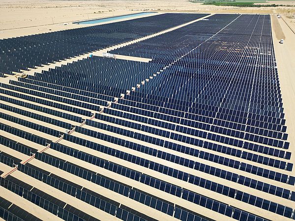 Array of polycrystalline silicon solar cells in solar power plant turned up skyward